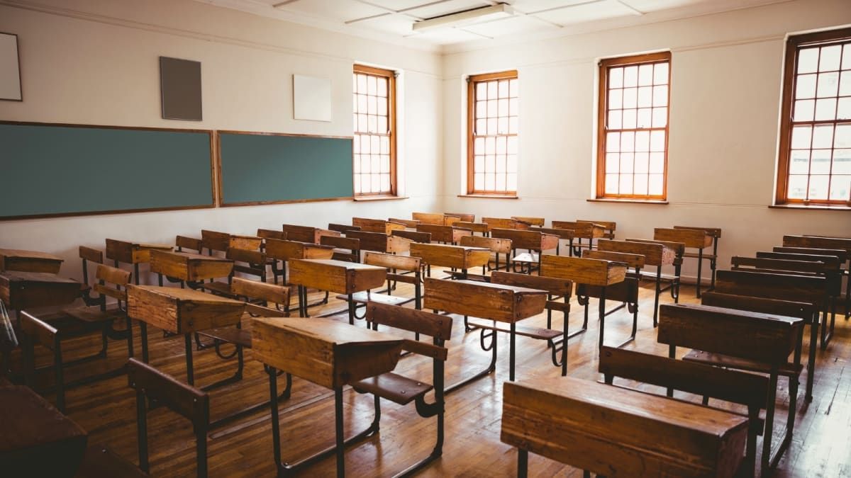 ** Electric bus equipped as mobile digital classroom parked outside rural school in Gujarat India