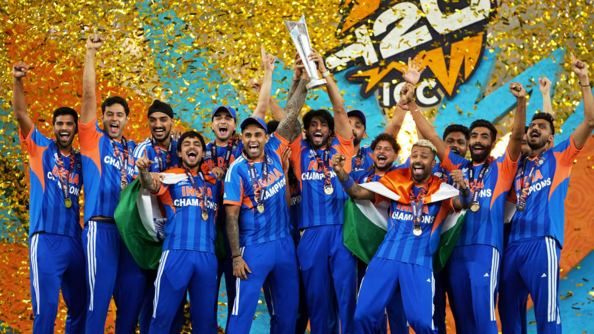 Indian cricket team celebrating with T20 World Cup trophy in Ahmedabad stadium