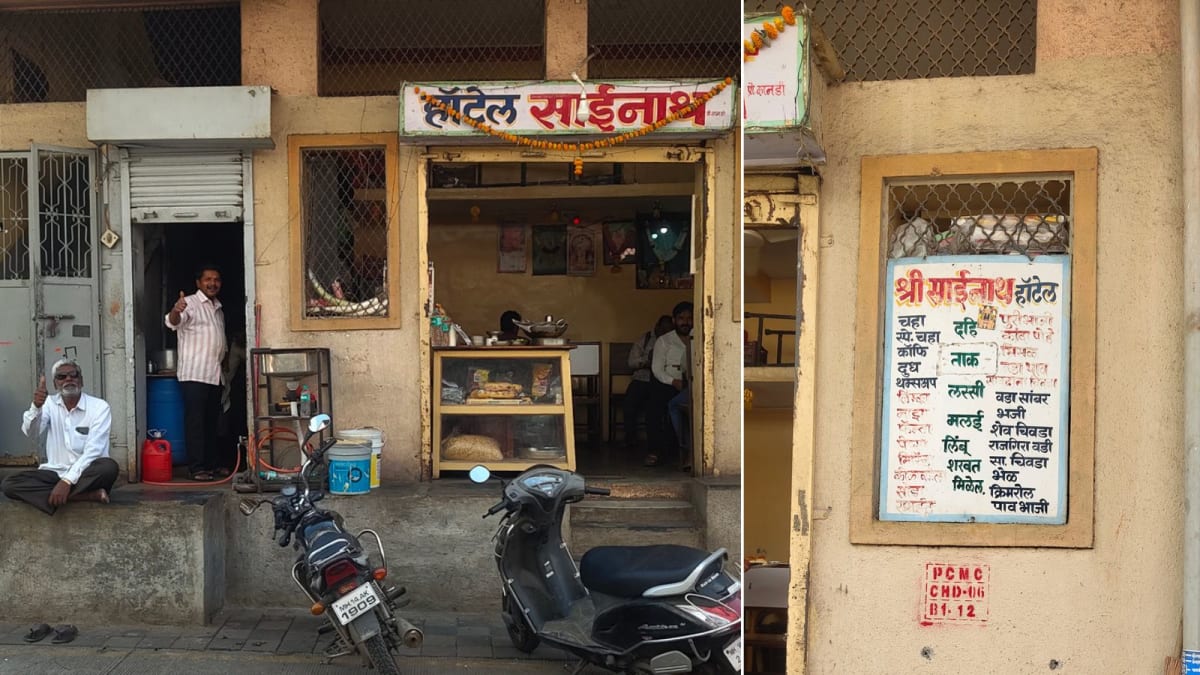 ** Busy traditional Indian restaurant interior with customers enjoying meals at wooden tables