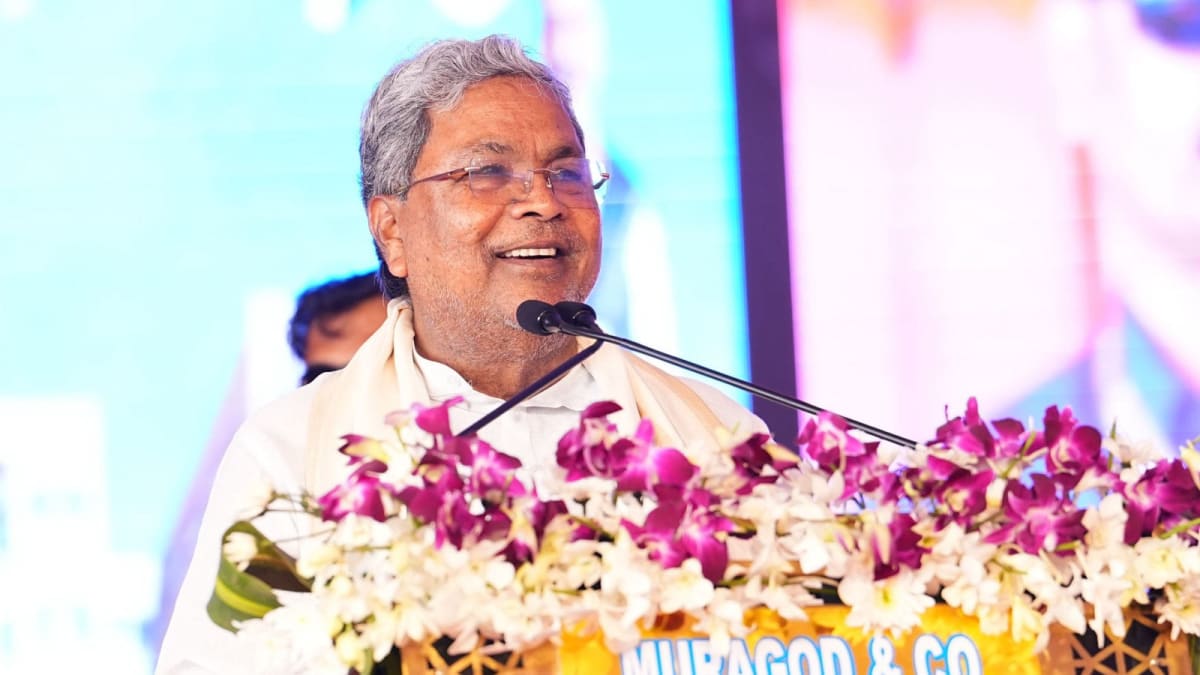** Chief Minister Siddaramaiah distributing appointment letters to families at Chamarajanagar ceremony