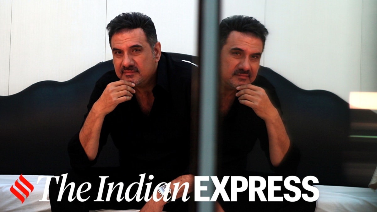 ** Actor Boman Irani speaking at an event, sharing his unconventional path to acting success