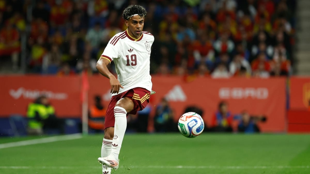 ** Young soccer player Lamine Yamal in Spanish national team jersey looking determined and focused