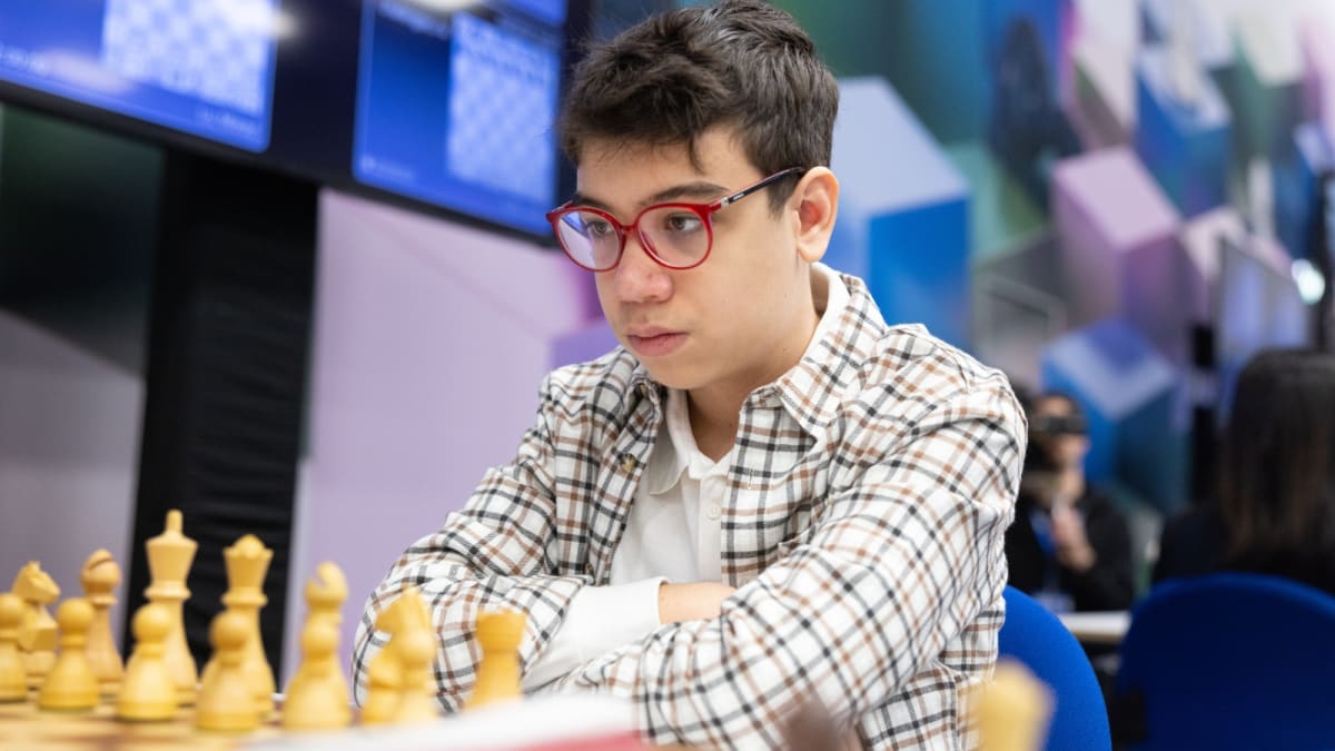 Young chess prodigy Faustino Oro concentrating during a chess tournament match