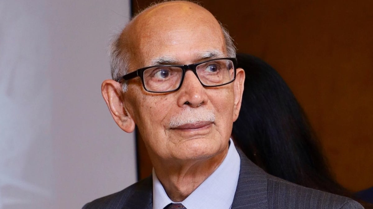 Gopal K Gureja at 90 years old holding his customer service book