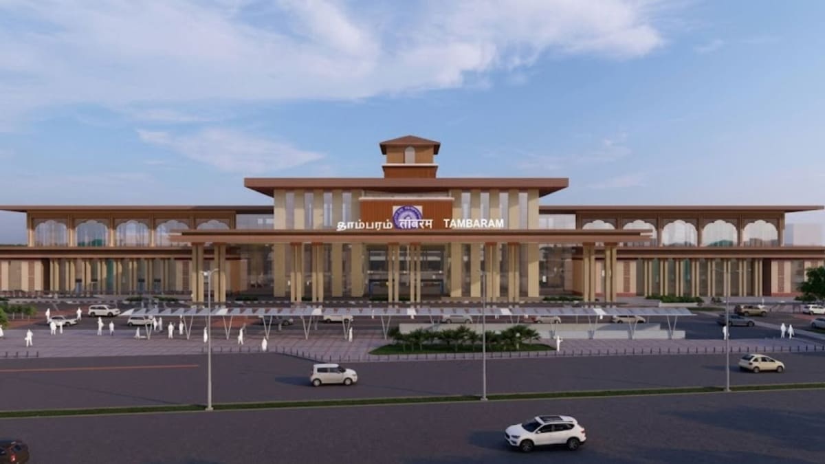 ** Wide pedestrian bridge spanning multiple railway platforms at modernized Tambaram station in Chennai, India