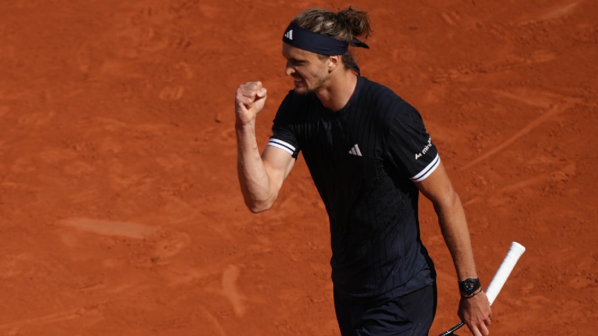 Alexander Zverev celebrates holding the French Open trophy above his head in Paris