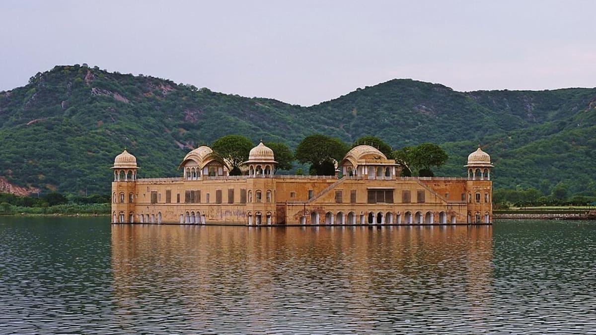 Historic Jal Mahal palace appearing to float on Man Sagar Lake in Rajasthan India