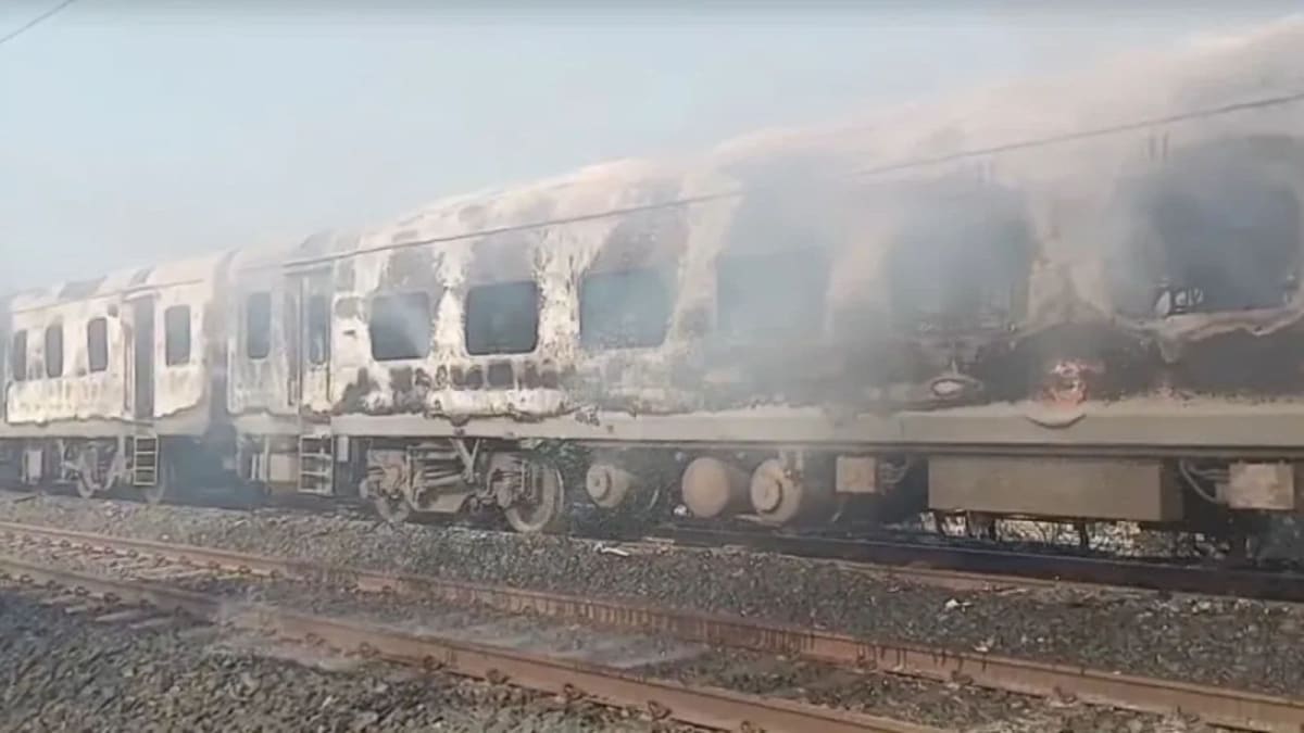 ** Railway inspector examining pantry car equipment during India's 15-day fire safety drive
