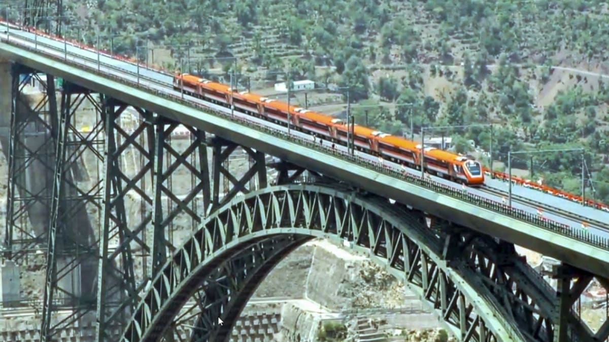 ** Modern Vande Bharat Express train traveling through scenic Kashmir mountain landscape with passengers aboard
