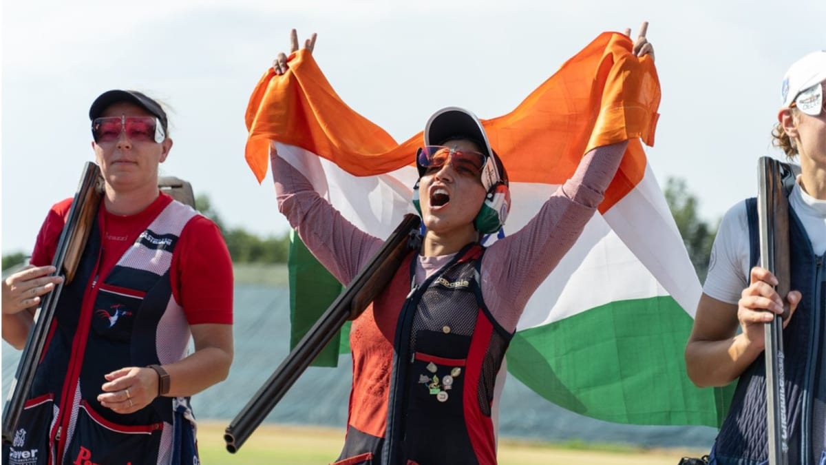 Neeru Dhanda stands on podium wearing gold medal at ISSF World Cup in Italy