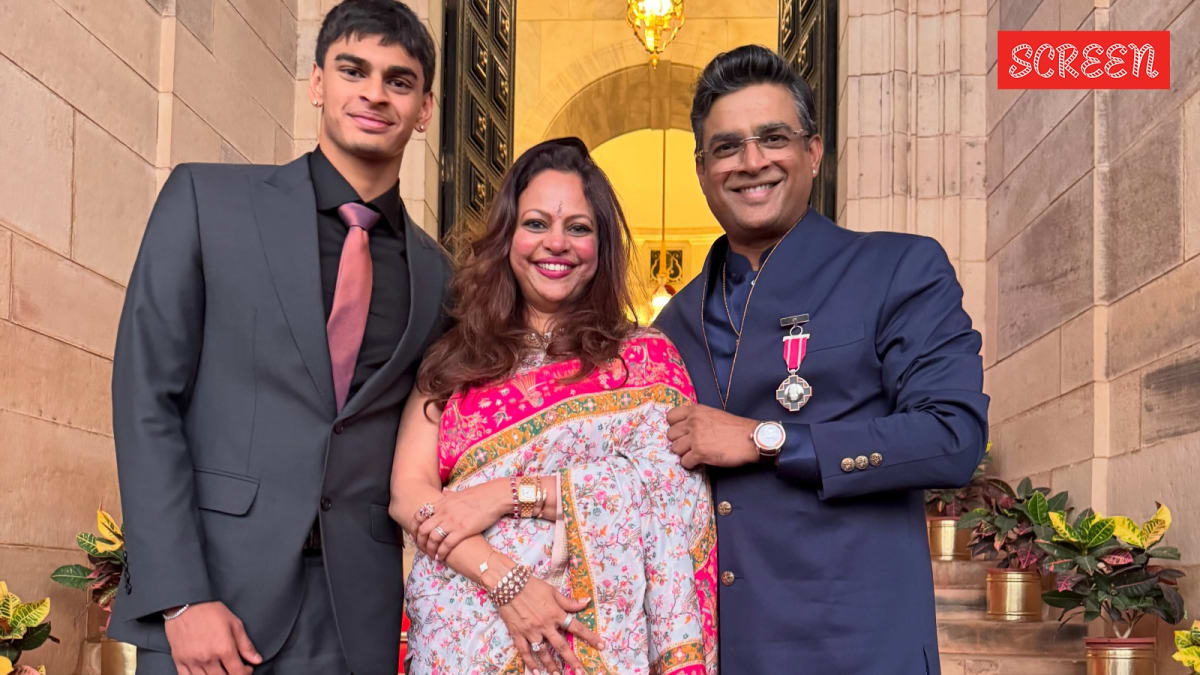 ** Indian actor R Madhavan smiling with his son Vedaant and wife Sarita Birje