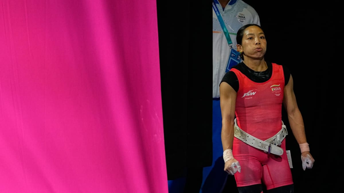 Mirabai Chanu prepares to lift weights at Commonwealth Games weightlifting competition in Glasgow