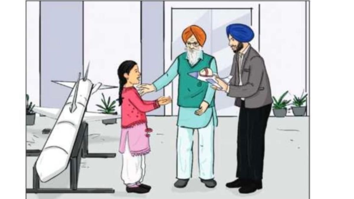 Young Indian schoolgirls in Punjab classroom reading new gender-inclusive textbooks together