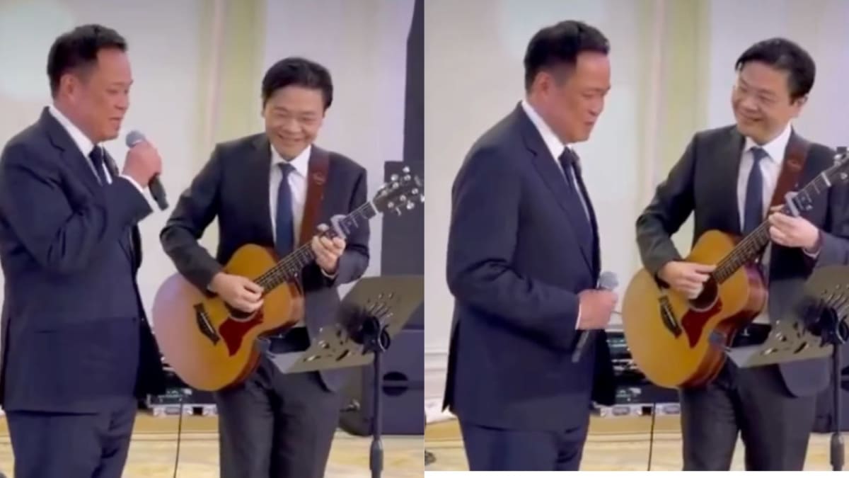 Thailand and Singapore prime ministers performing music together during diplomatic retreat in Bangkok