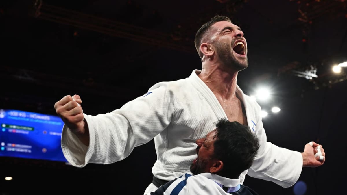 Israeli judoka Peter Paltchik competing in his blue gi uniform at Paris Olympics