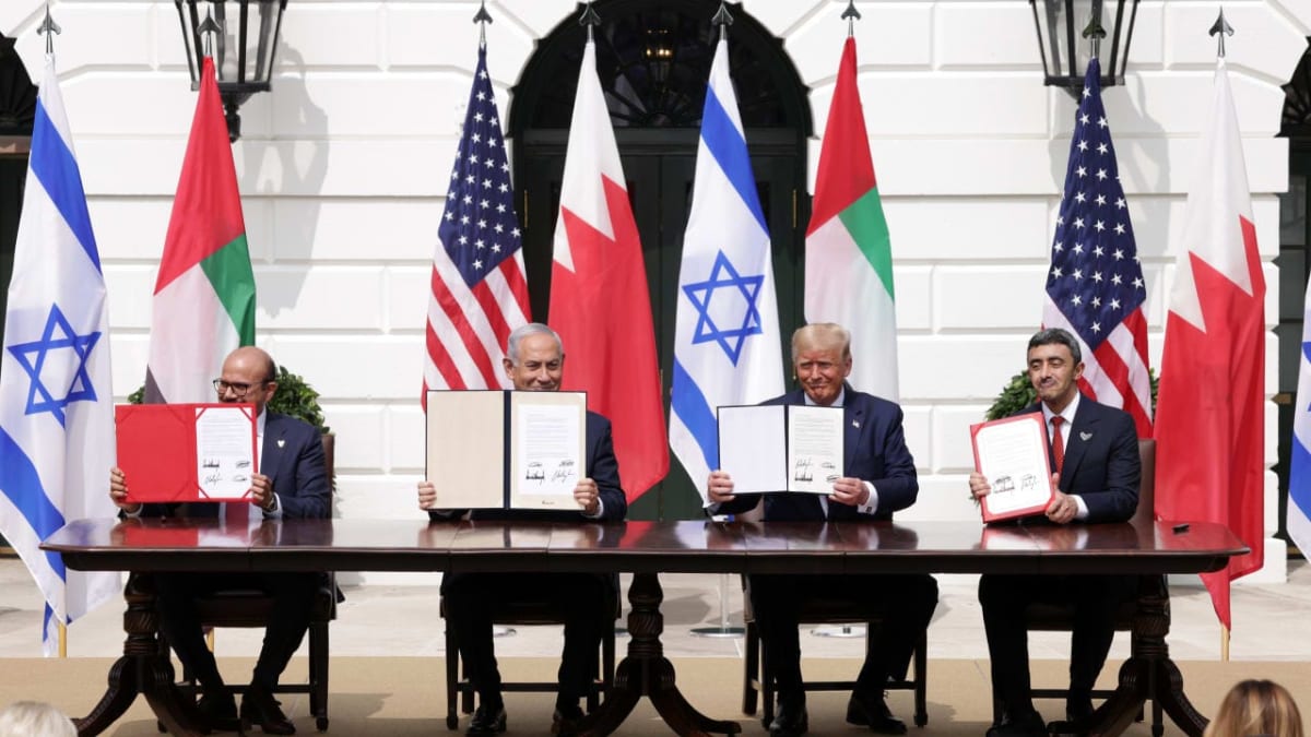 Israeli, UAE, and Bahraini flags displayed together commemorating Abraham Accords anniversary