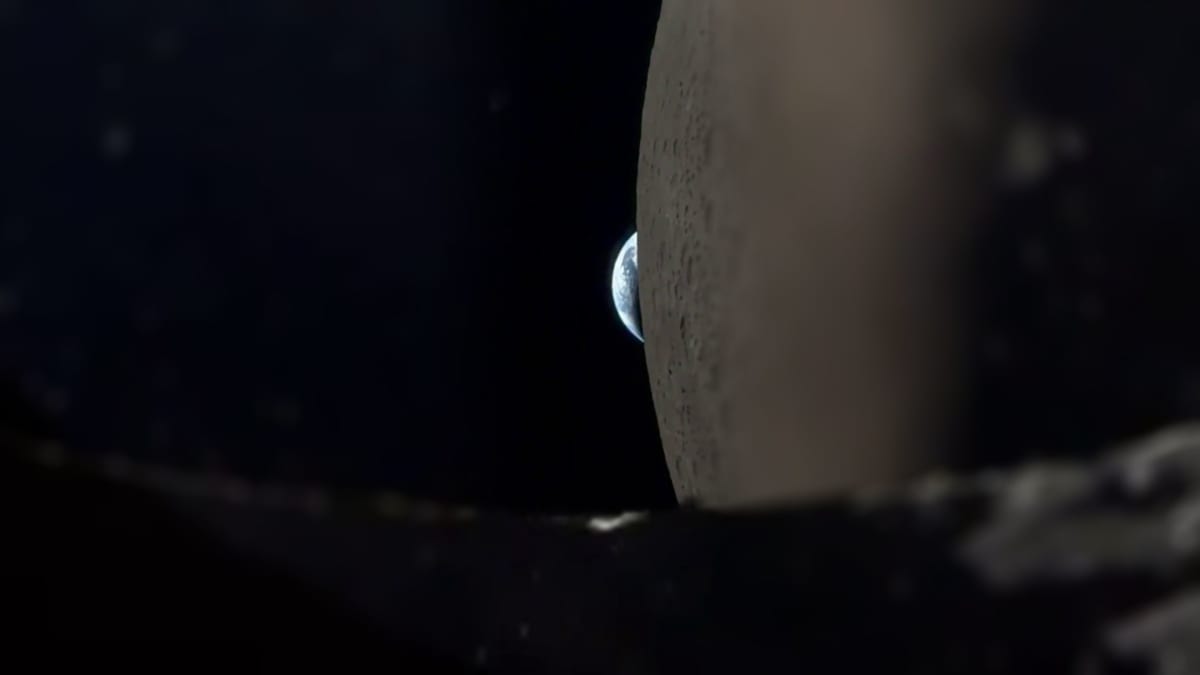 Earth disappearing behind Moon's cratered surface filmed from NASA spacecraft window