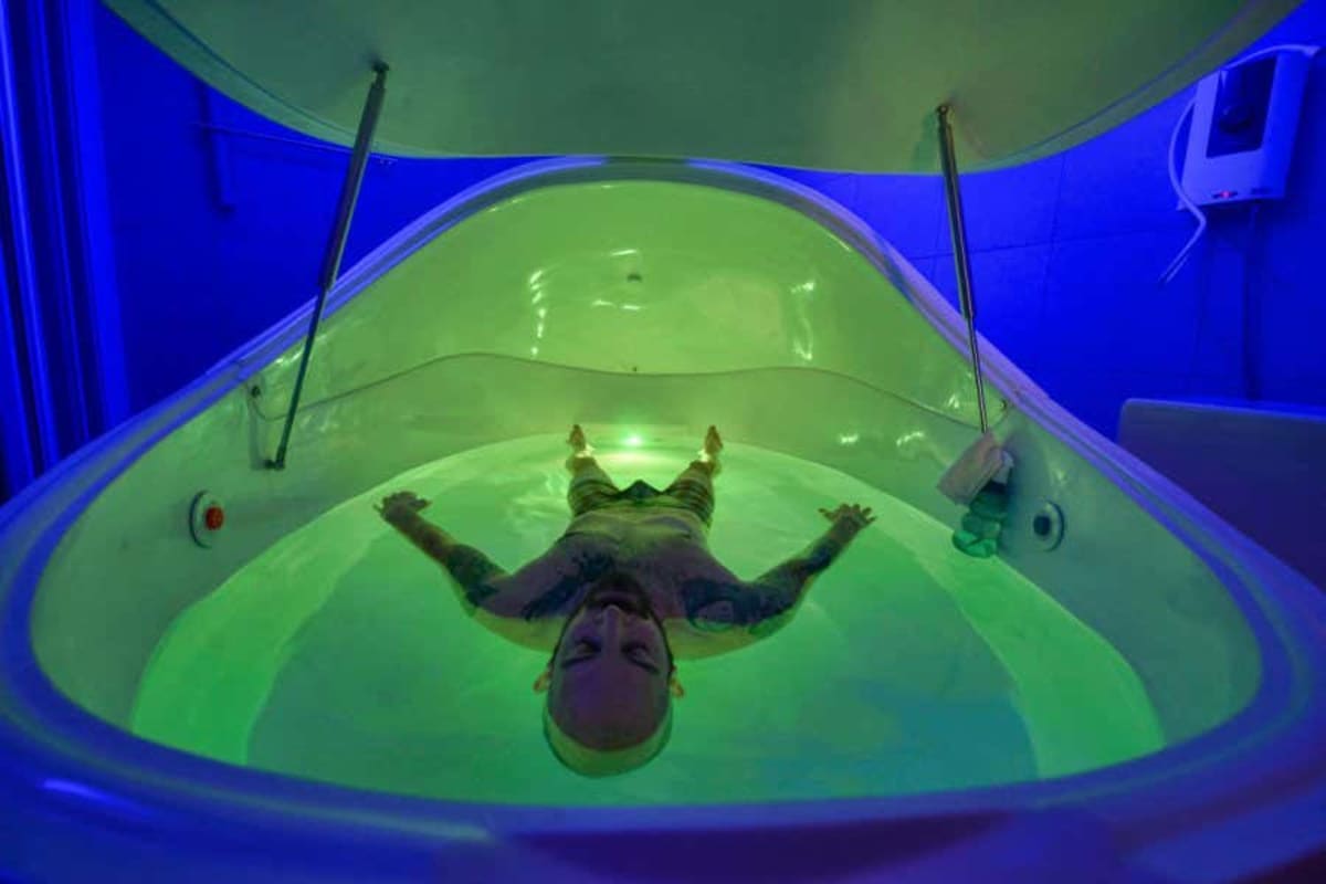 Mobile floatation tank therapy pods inside shipping container being deployed for disaster relief