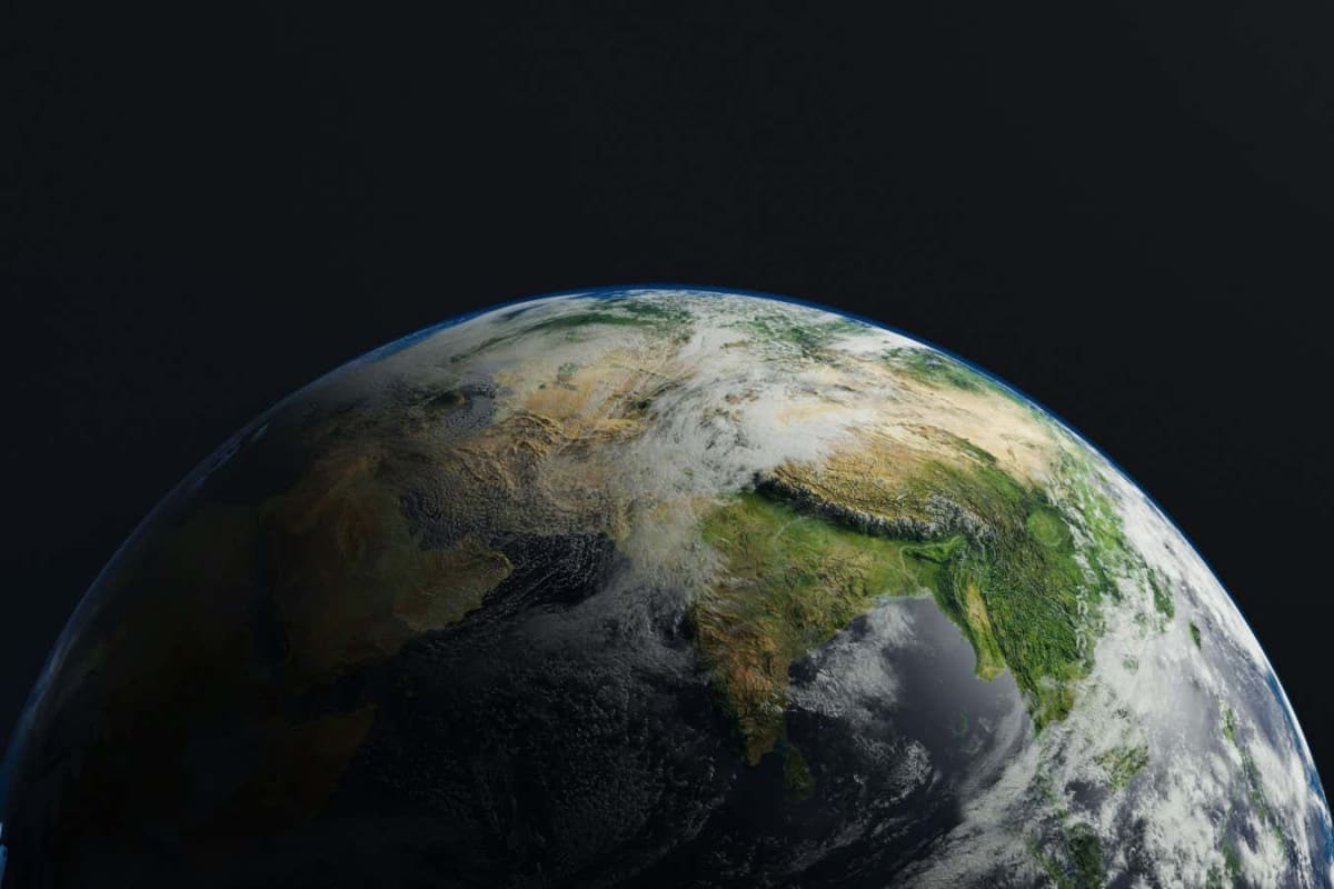 Artist rendering of Earth's distant future with expanded sun on horizon and vegetation
