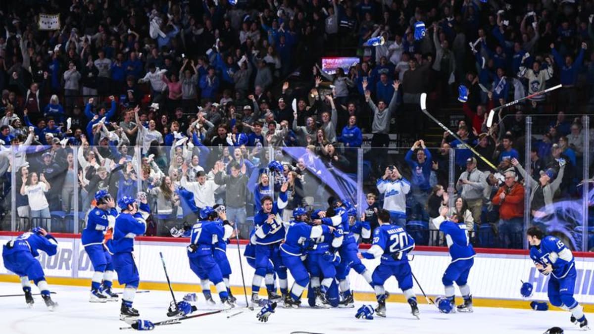 Hamilton College hockey players celebrating their first NCAA Division III championship victory on ice