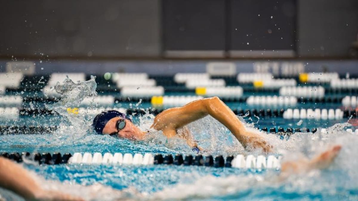 Hannah Rutten swimming butterfly stroke during Northern Arizona University Pentathlon competition