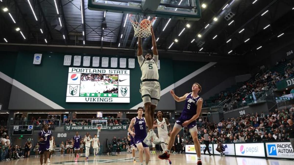 Portland State Vikings basketball players celebrating their Big Sky Conference regular season championship title