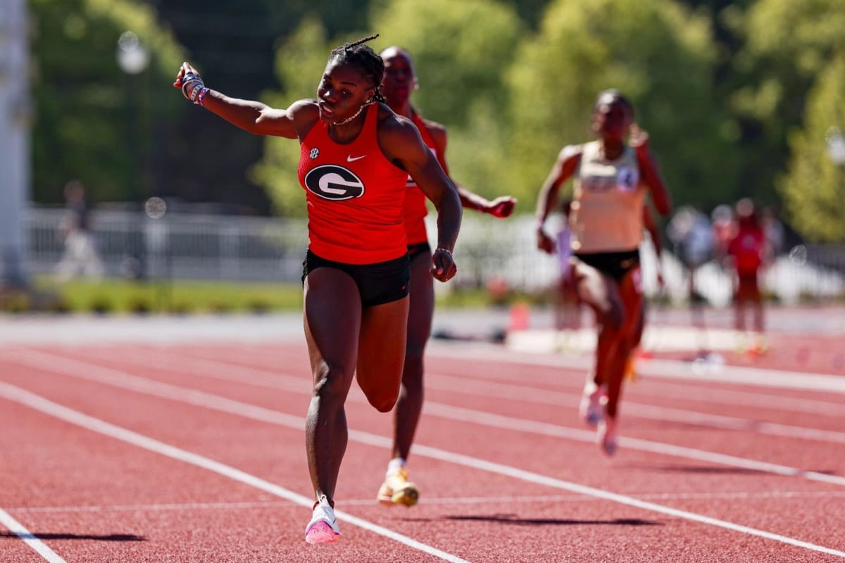 University of Georgia sprinter Adaejah Hodge racing down track in red uniform