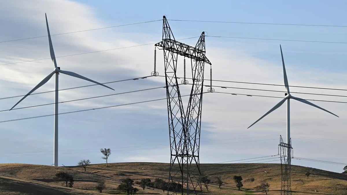 Solar panels and wind turbines generating renewable electricity under bright blue Australian sky