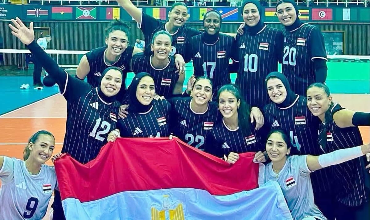 Egyptian women's volleyball team celebrates their World Cup qualification with raised arms and smiles