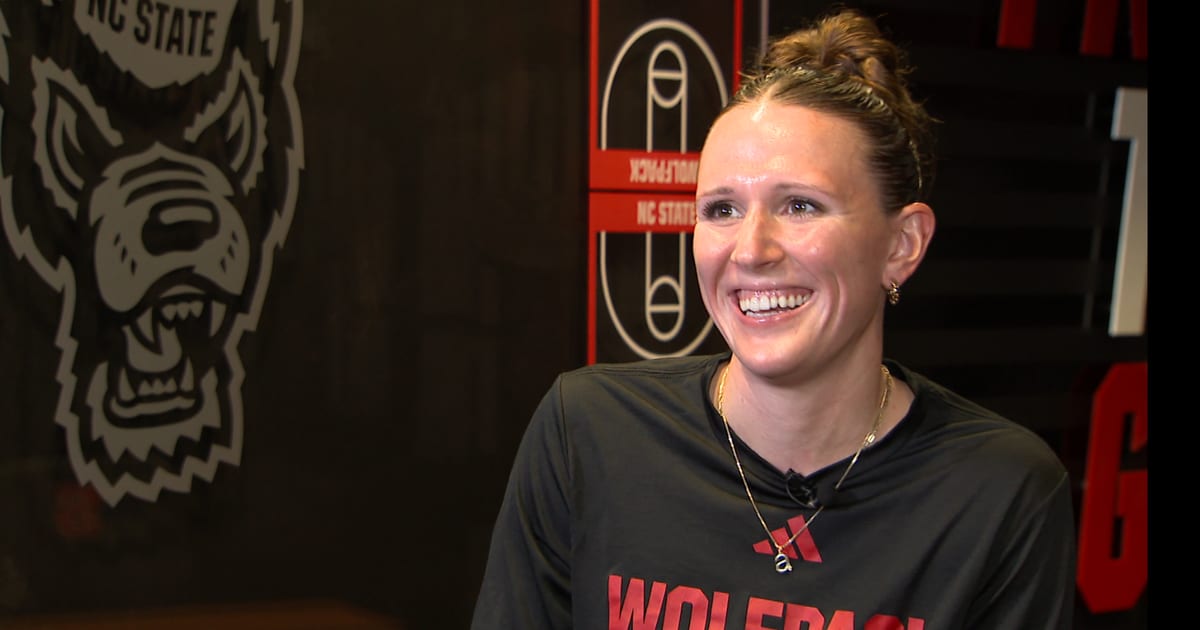 ** NC State women's basketball player Audrey Ericksen celebrates with teammates after scholarship surprise