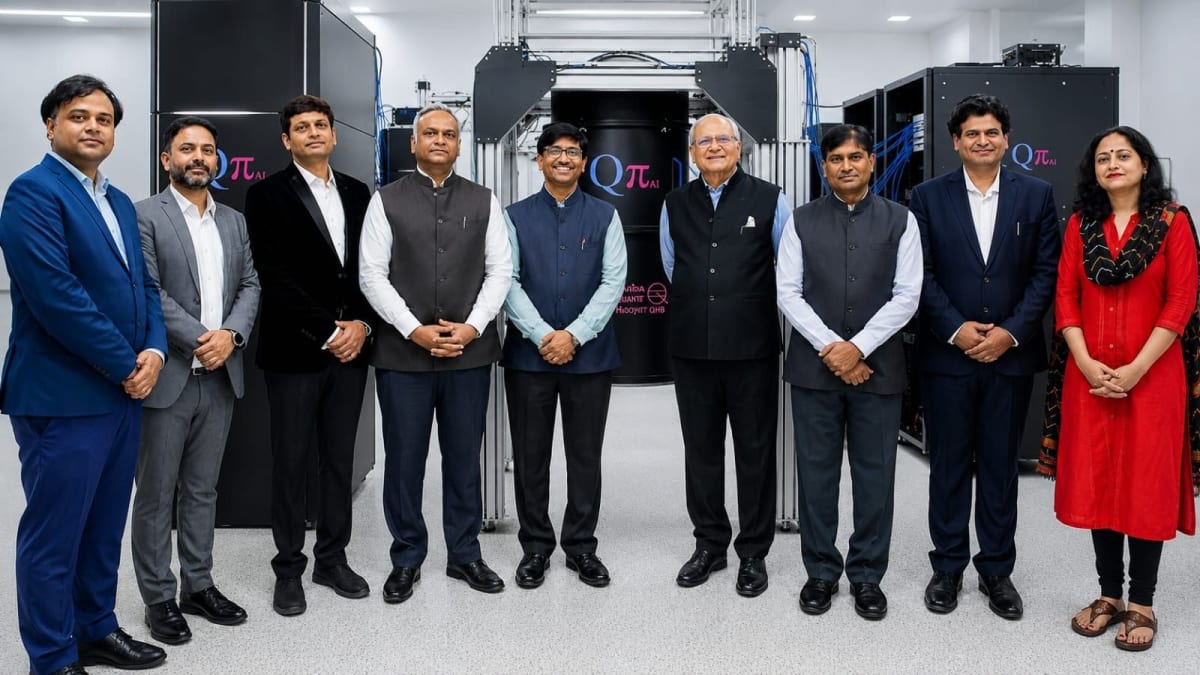 Scientists in white clean room suits working on quantum computing chips in modern manufacturing facility
