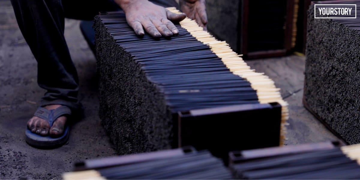 Workers in Kannauj India preparing traditional incense sticks in modern production facility