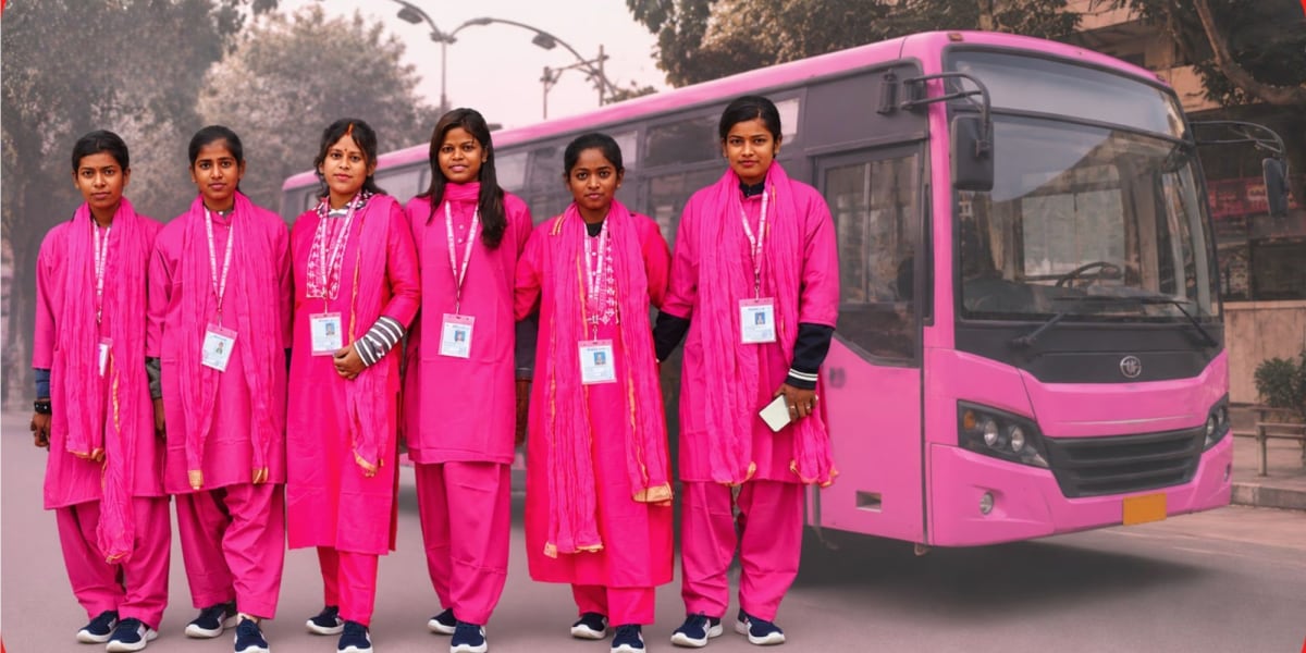 Young Indian woman in uniform sitting confidently in driver's seat of pink-colored public bus