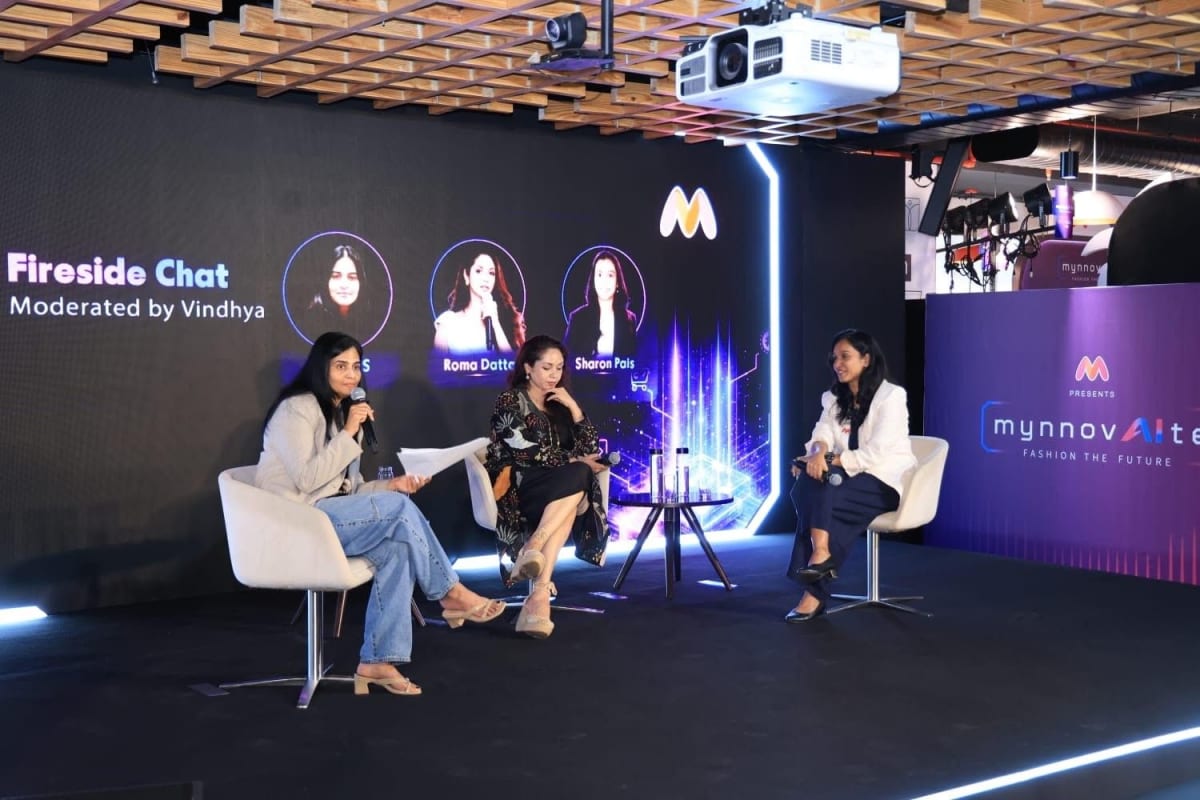 Women working collaboratively on computers in modern office technology workspace