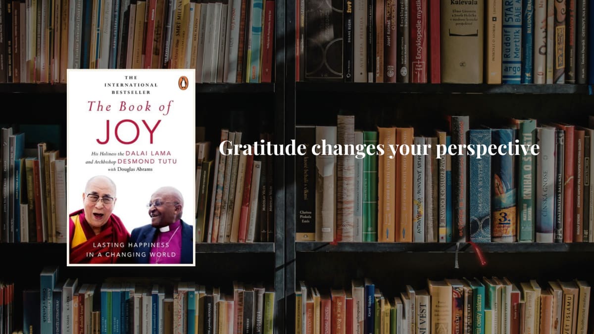 The Dalai Lama and Archbishop Desmond Tutu laughing together during their conversation about joy