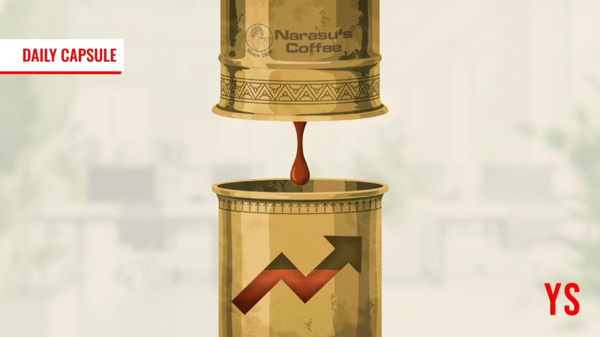 Traditional South Indian filter coffee being poured from brass vessel into tumbler