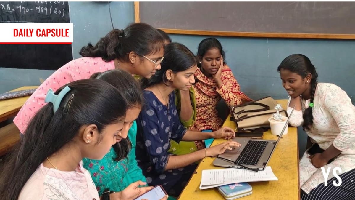 ** Young women working on laptops coding AI solutions at technology hackathon competition