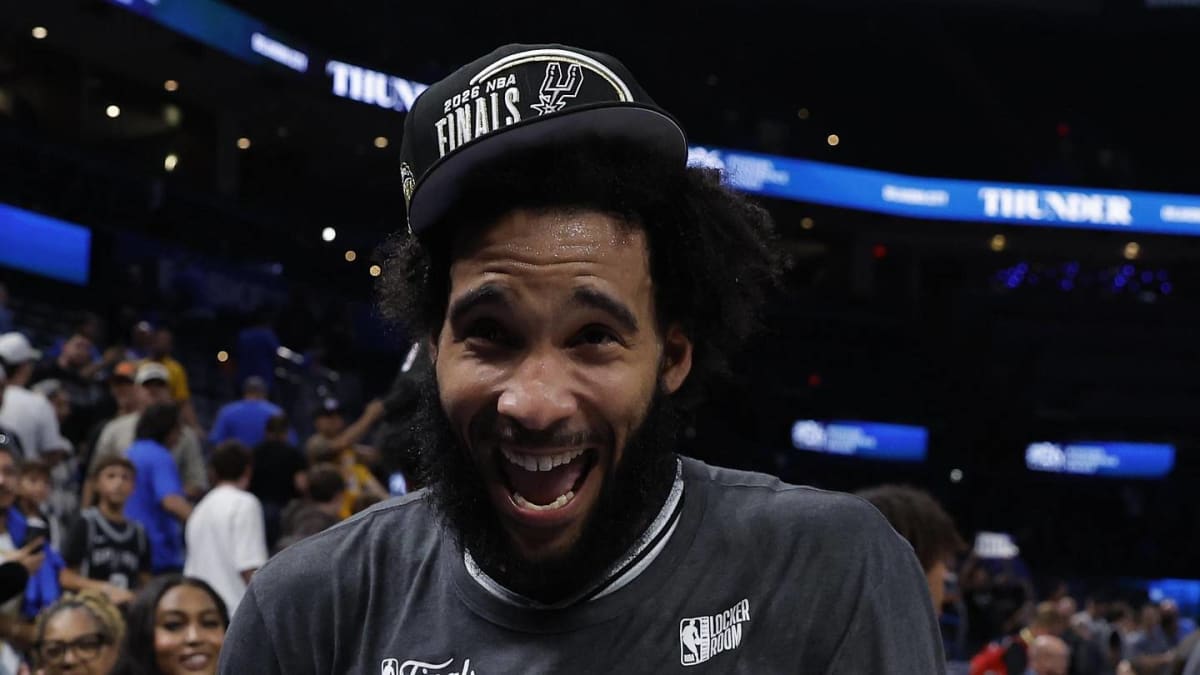 Julian Champagnie shooting a three-pointer in Spurs uniform during playoff game