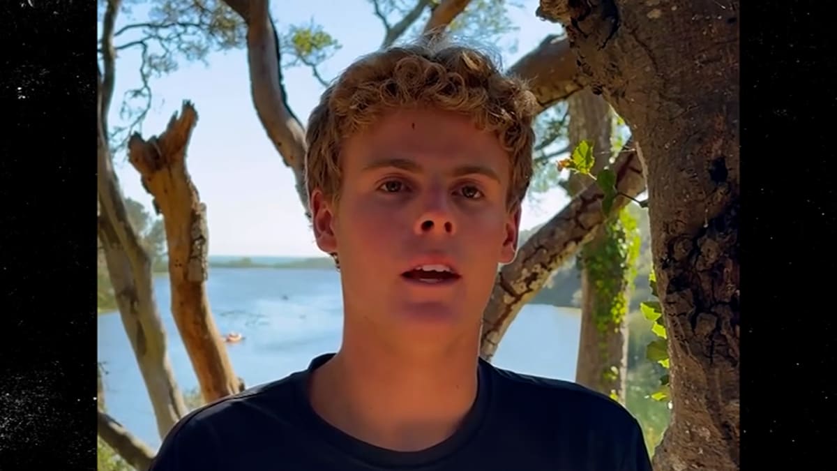 Teenage lifeguard Ryder Williams sprinting into ocean waves during dramatic beach rescue at California coast