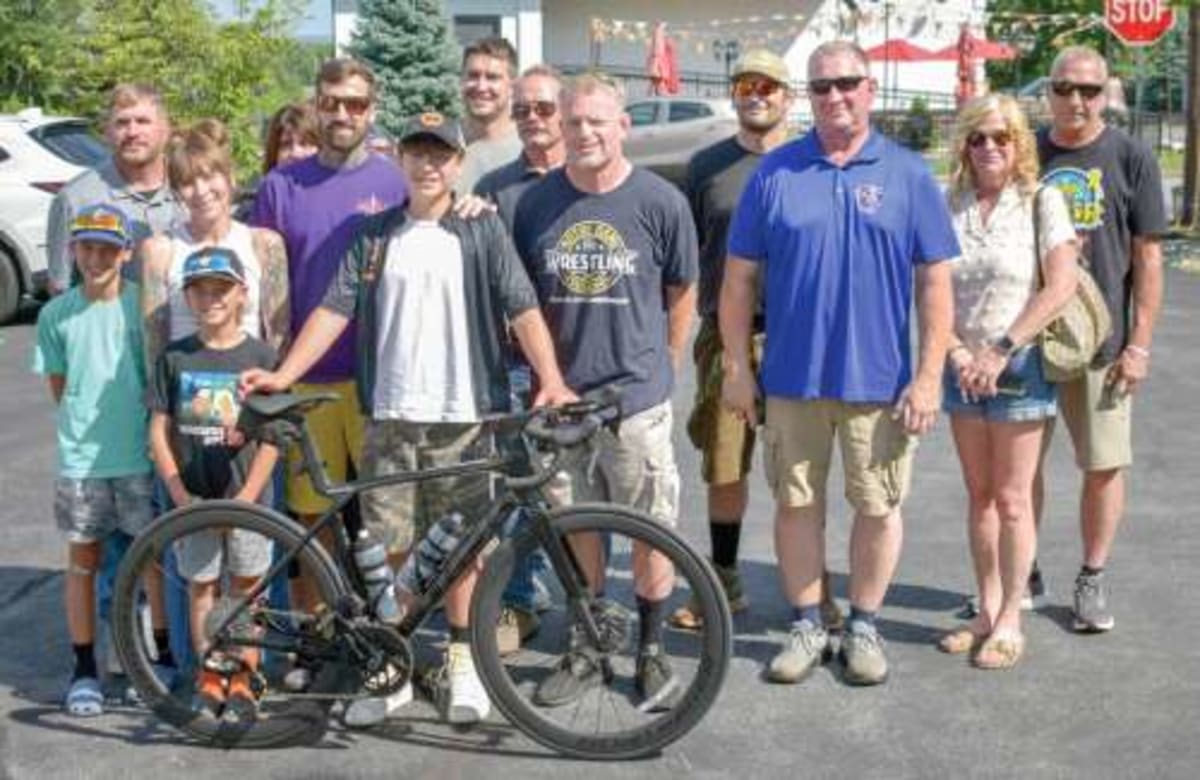 Teen Cancer Survivor Gets New Bike from Union Workers