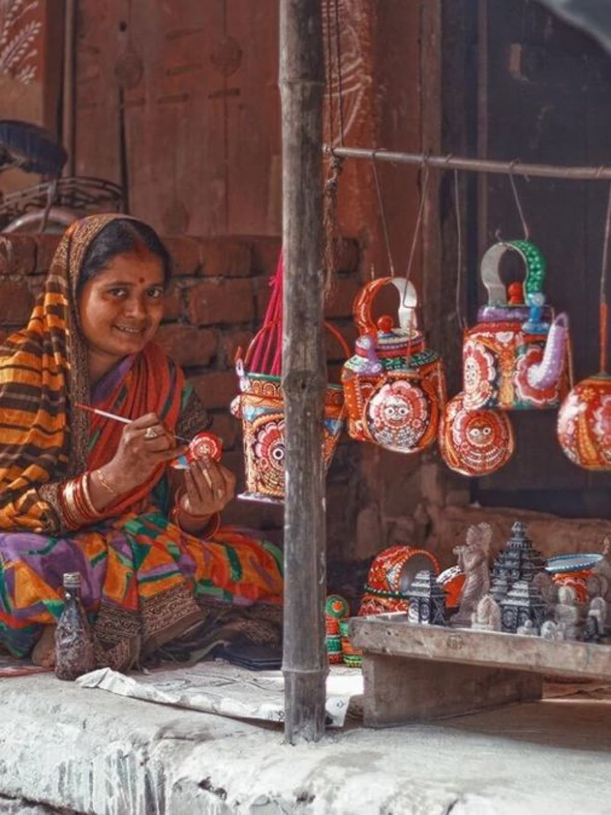 Colorful traditional Indian village scene showing artisans preserving centuries-old cultural crafts and customs