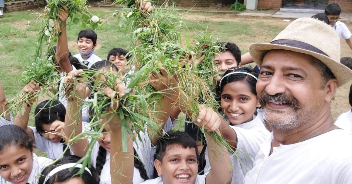 Former journalist Hitarth Pandya teaching young students about soil and farming basics in Vadodara school