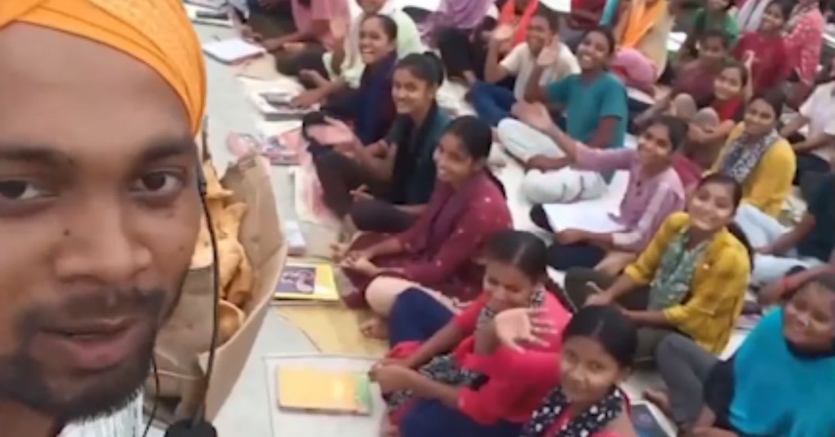 Rohit Kumar teaching children science on crowded rooftop classroom in Bihar India