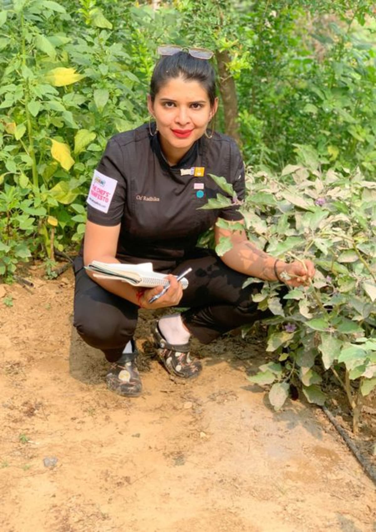 Chef Radhika Khandelwal preparing dishes with rare indigenous Indian vegetables and flowers in Delhi restaurant kitchen