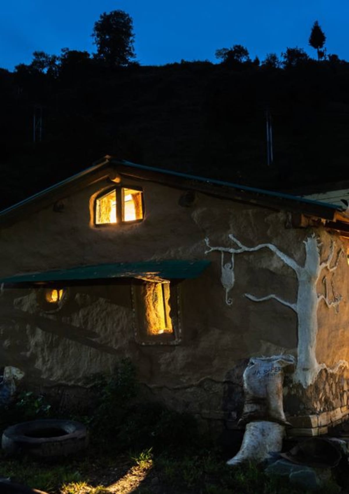 Rustic mud cottage with thick earthen walls nestled in Uttarakhand mountains India