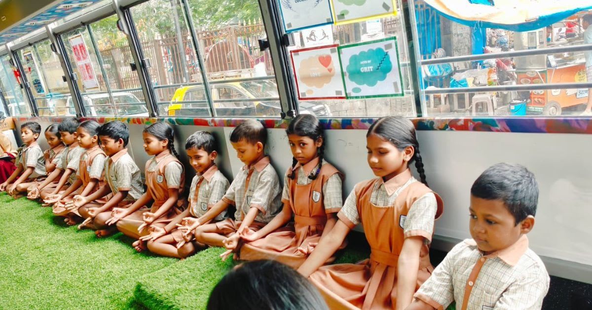 Colorful bus classroom with children learning music in Mumbai neighborhood