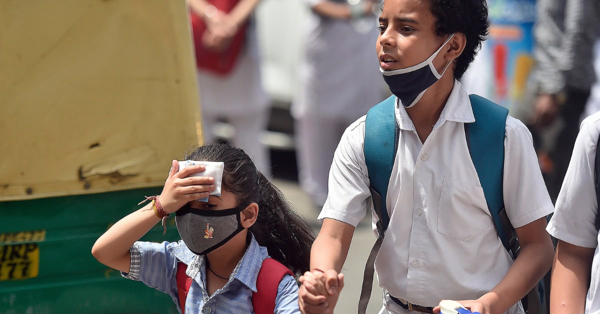 Indian school children playing in shaded outdoor area during cooler morning hours