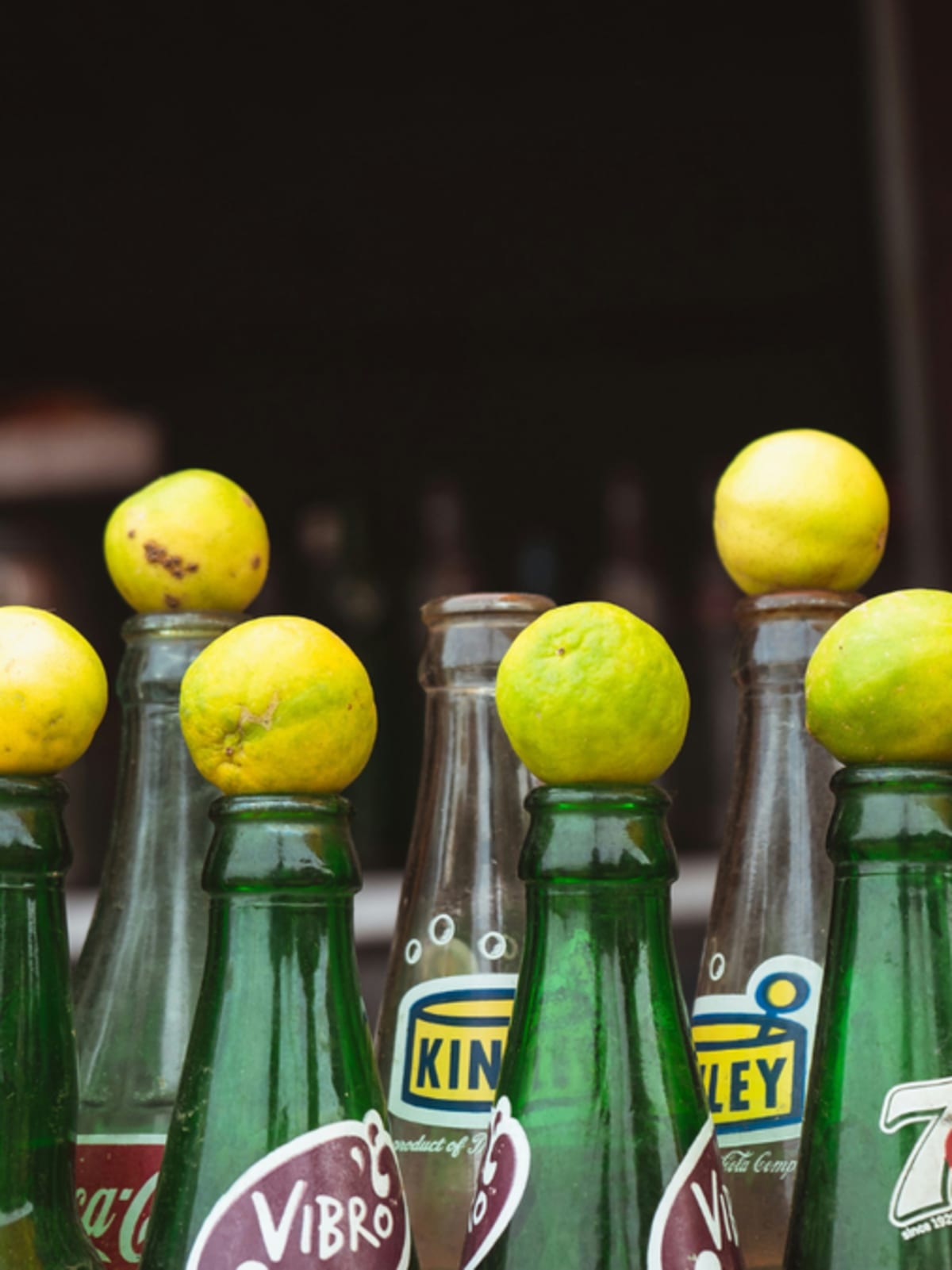 Colorful traditional Indian summer drinks in glasses including pink kokum sharbat and golden aam panna