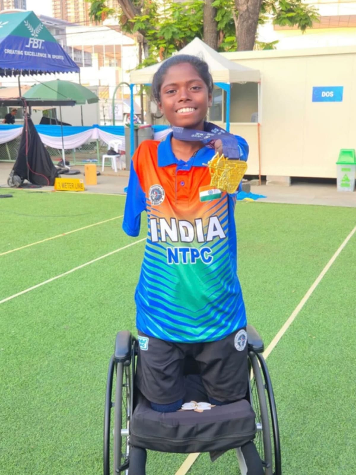 Payal Nag holding compound bow at archery competition in Bangkok, Thailand