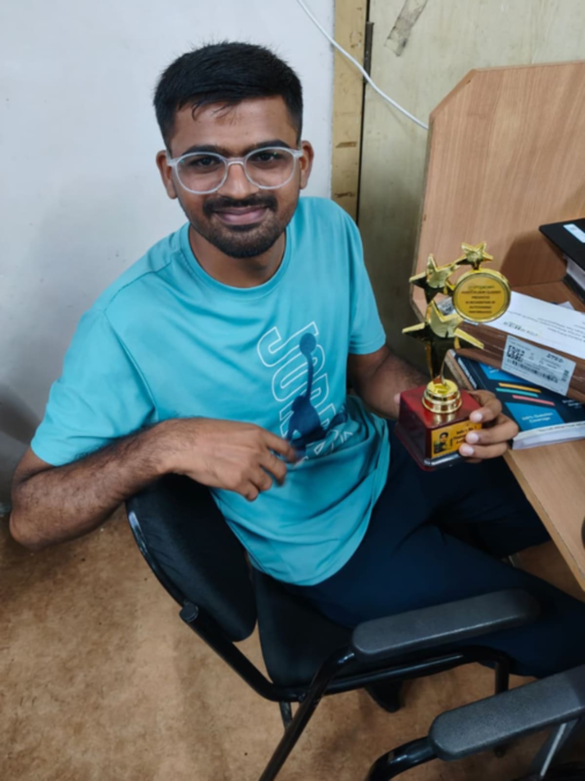 Young Indian man in professional attire smiling after becoming a Chartered Accountant